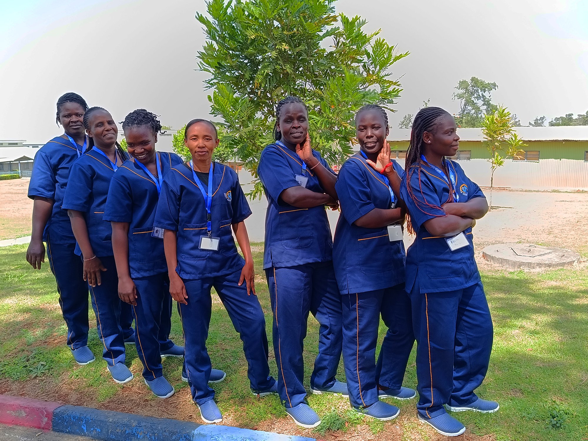Dorsa female cleaning crew members in uniform, Nairobi